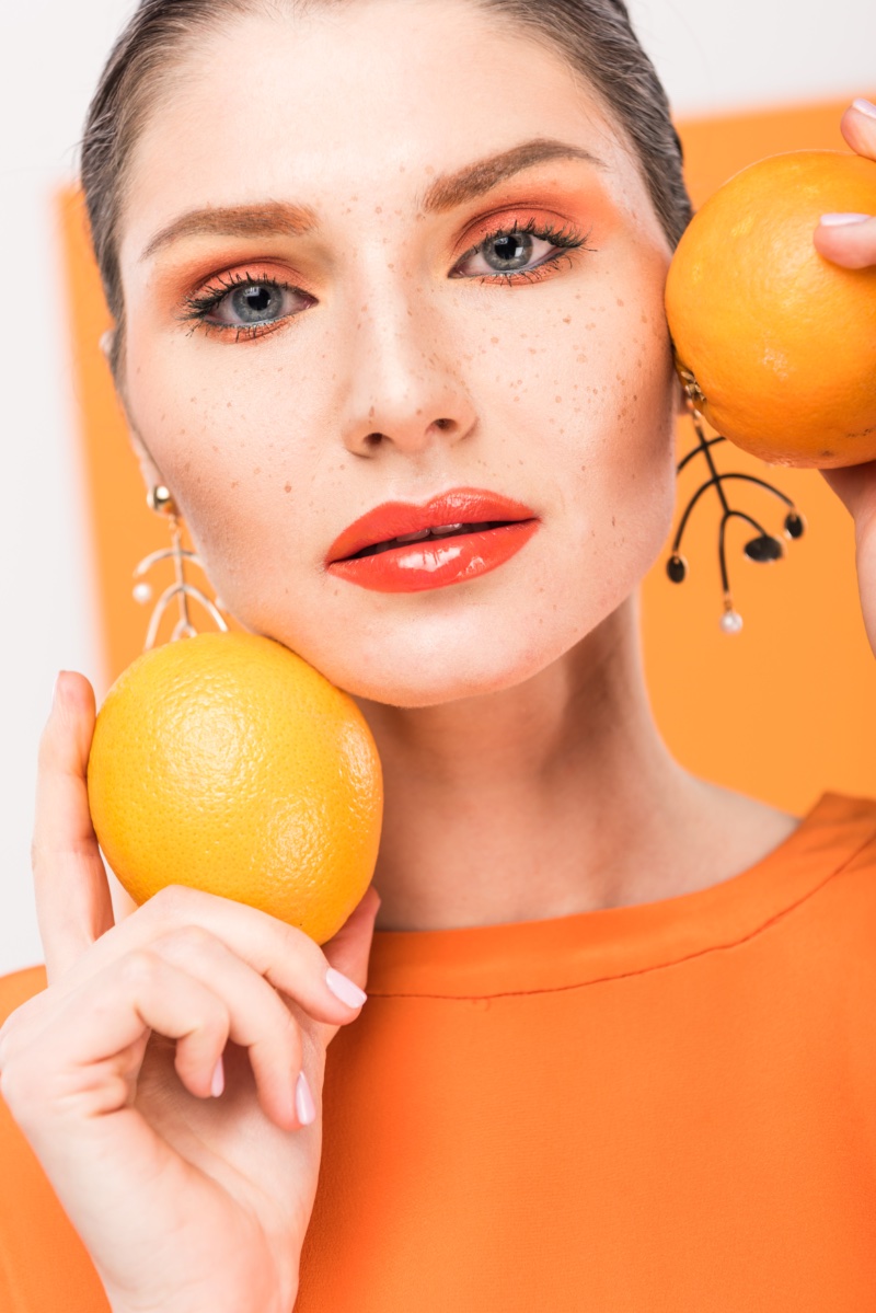 Woman Oranges Vitamins for Skin